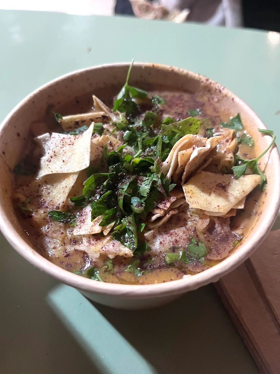Homemade lentil soup with croutons and parsley at Sumac